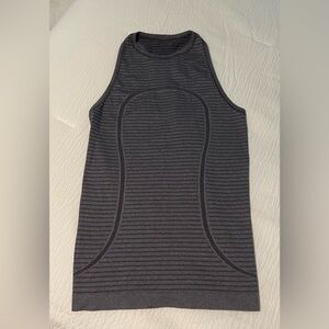 Lululemon women’s dark purple racer back tank top size 6. Great condition.